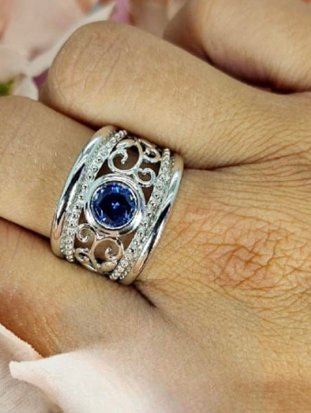Sterling silver filigree detail ring with blue cubic zirconia