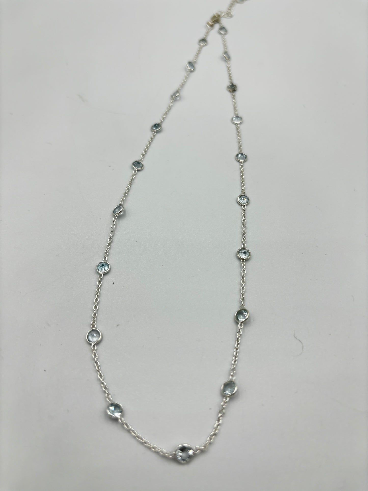 Sterling silver necklace with 5mm blue Topaz semi Precious stones in-bedded in necklace