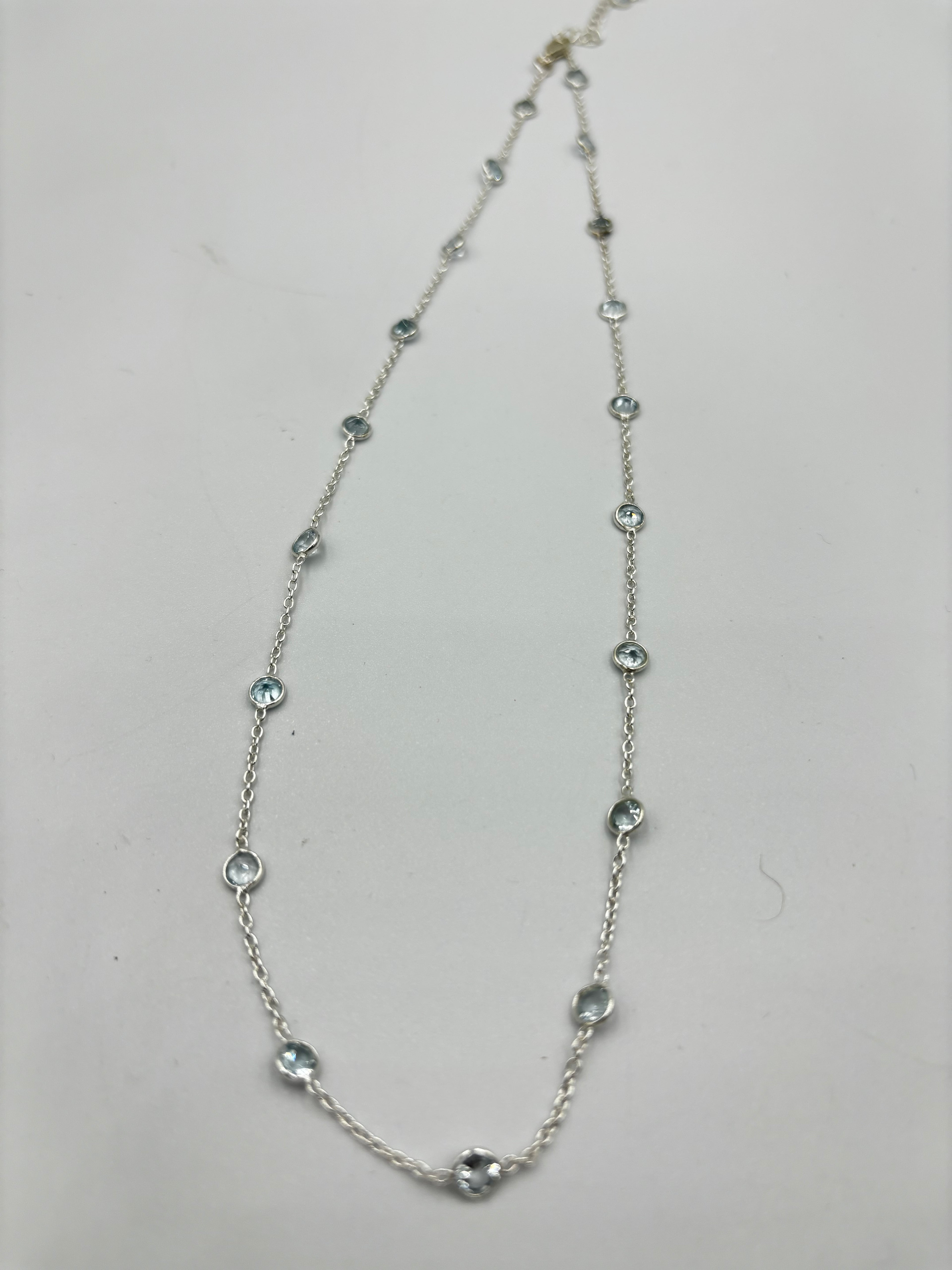 Sterling Silver Necklace With 5Mm Blue Topaz Semi Precious Stones In-Bedded In Necklace