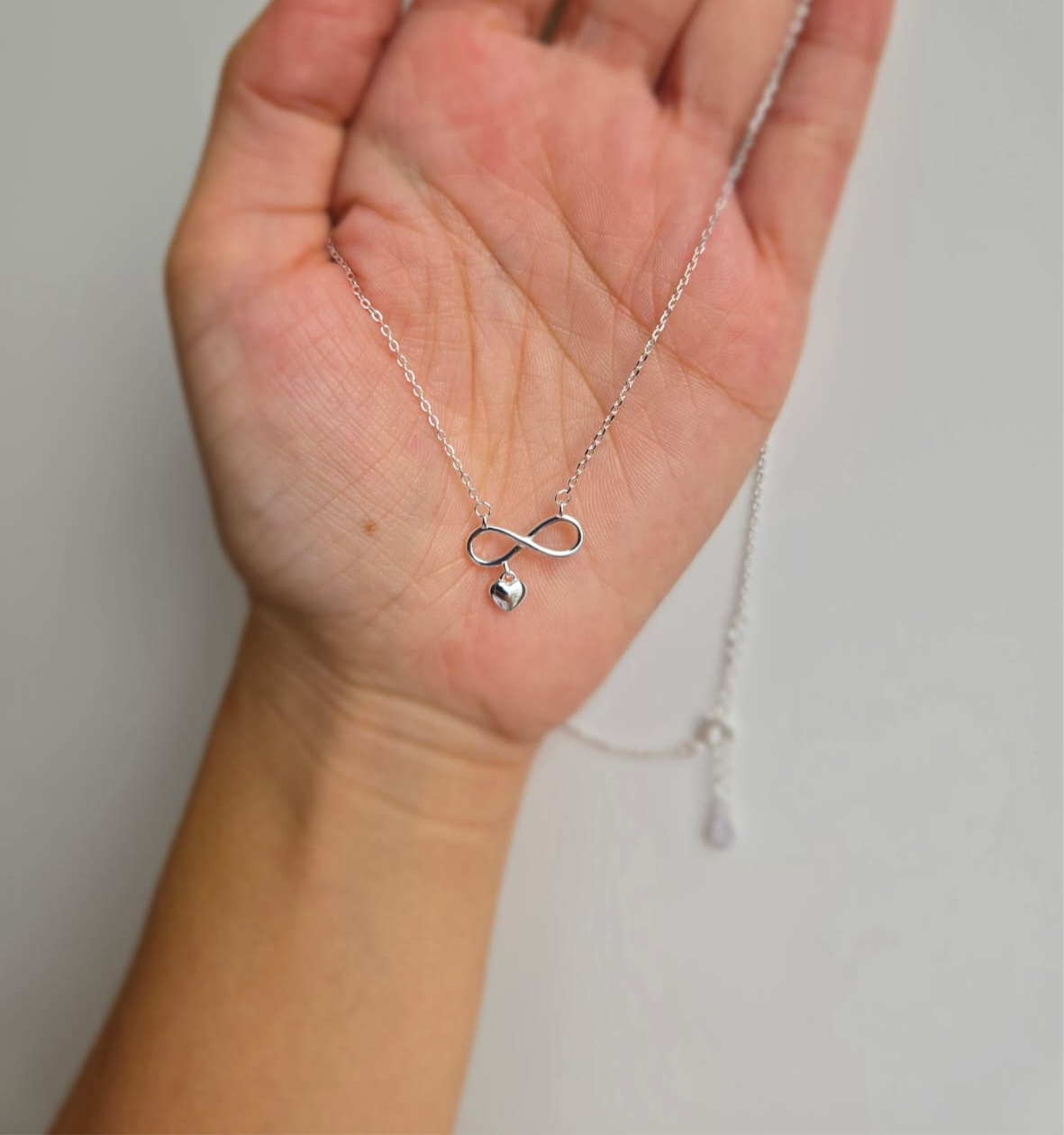 Sterling Silver Infinity Necklace With Little Heart Attached