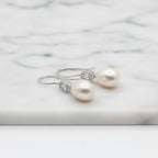 Elegant Freshwater Pearl Drops With Oval Cubic In Tube Earrings