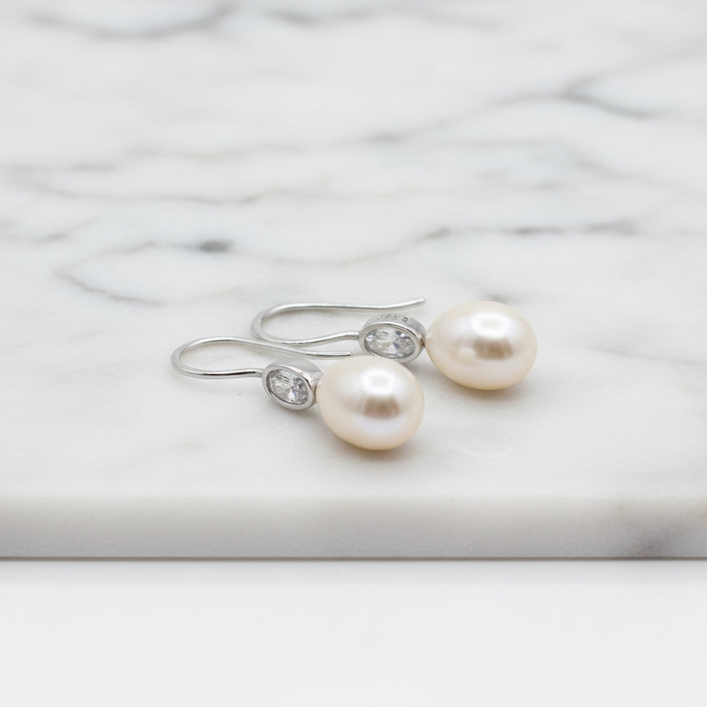 Elegant Freshwater Pearl Drops With Oval Cubic In Tube Earrings