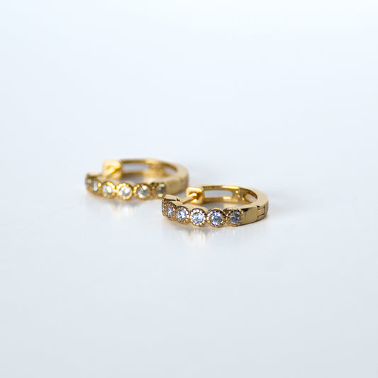 Golden Huggy earrings with tube setting stones