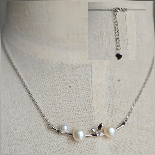 Beautiful necklace with bird on branch and freshwater pearls