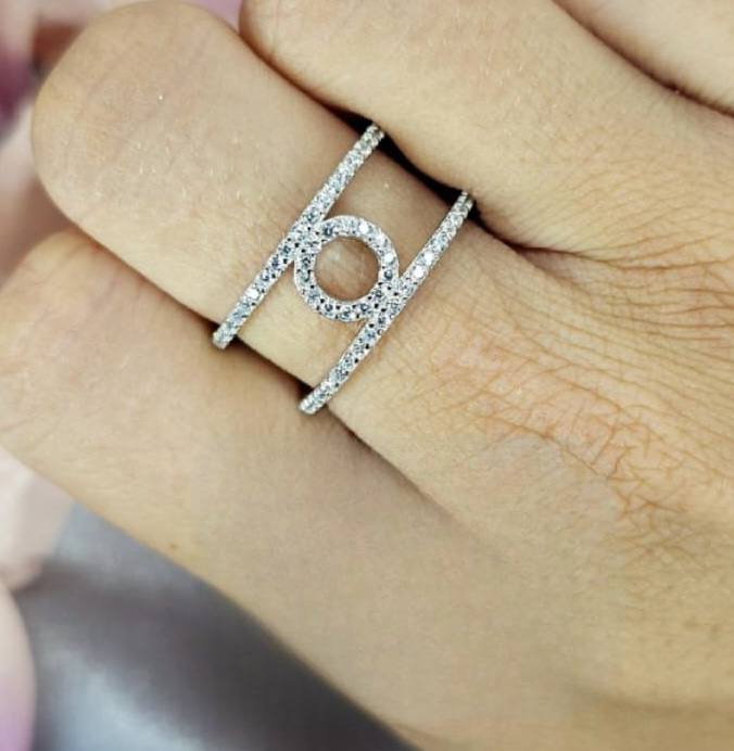 Cubic zirconia pavé ring with two bands and circle in centre