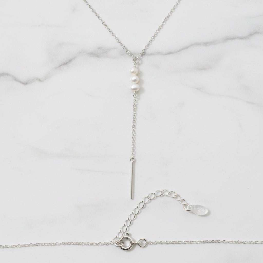 Chain with deep V and three freshwater pearls in drop