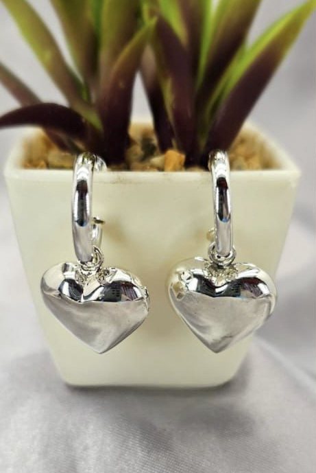 Large hearts on pretty woman earrings