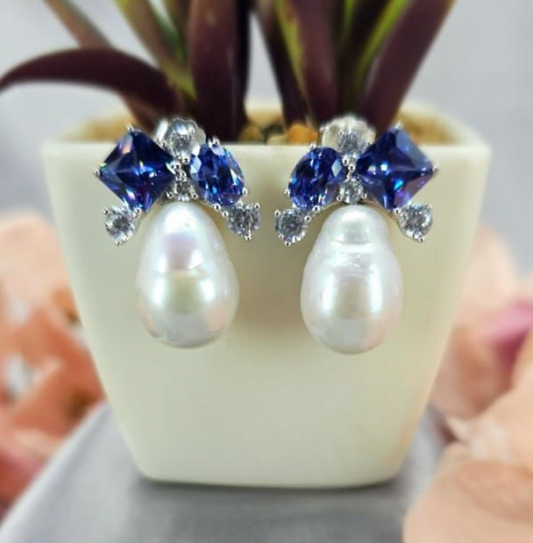 Stunning statement earrings featuring awesome pearl and blue cubic zirconia