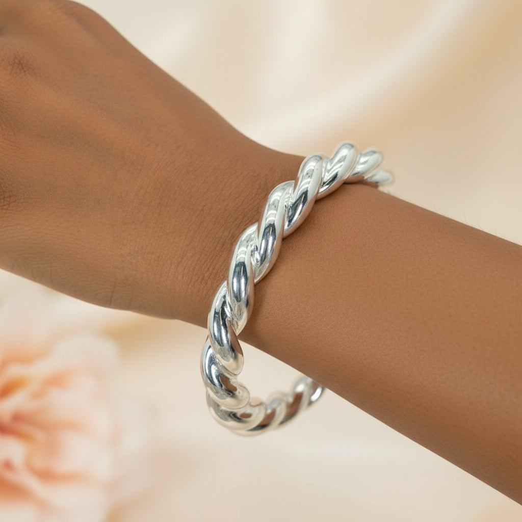 A sterling silver chunky hollow rope bracelet on a person's wrist, with a label showing the rope width as 10mm.
