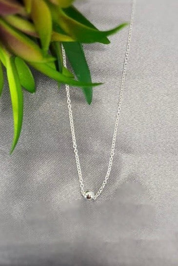 Necklace with tiny ball
