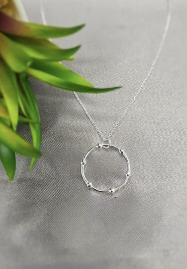 Sterling silver necklace with detailed circle centre