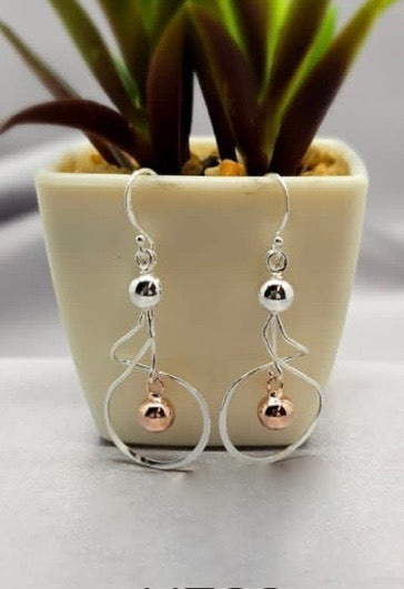 Sterling silver drop earrings with silver and rose gold ball detail