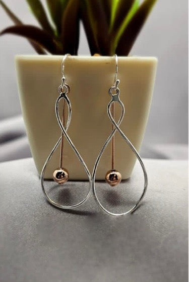 Twist and turn sterling silver drop earrings with rose gold dangle