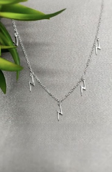 Necklace with tiny lightning bolts