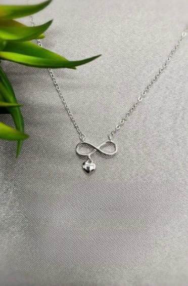 Sterling silver infinity necklace with little heart attached