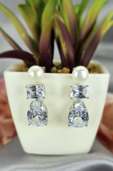 Stunning eye catching drop earrings with beautiful freshwater pearls and the brilliant cut cubic zirconia drops