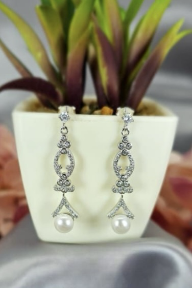 Sterling silver drop earrings with cubic zirconia detail and freshwater pearl on end
