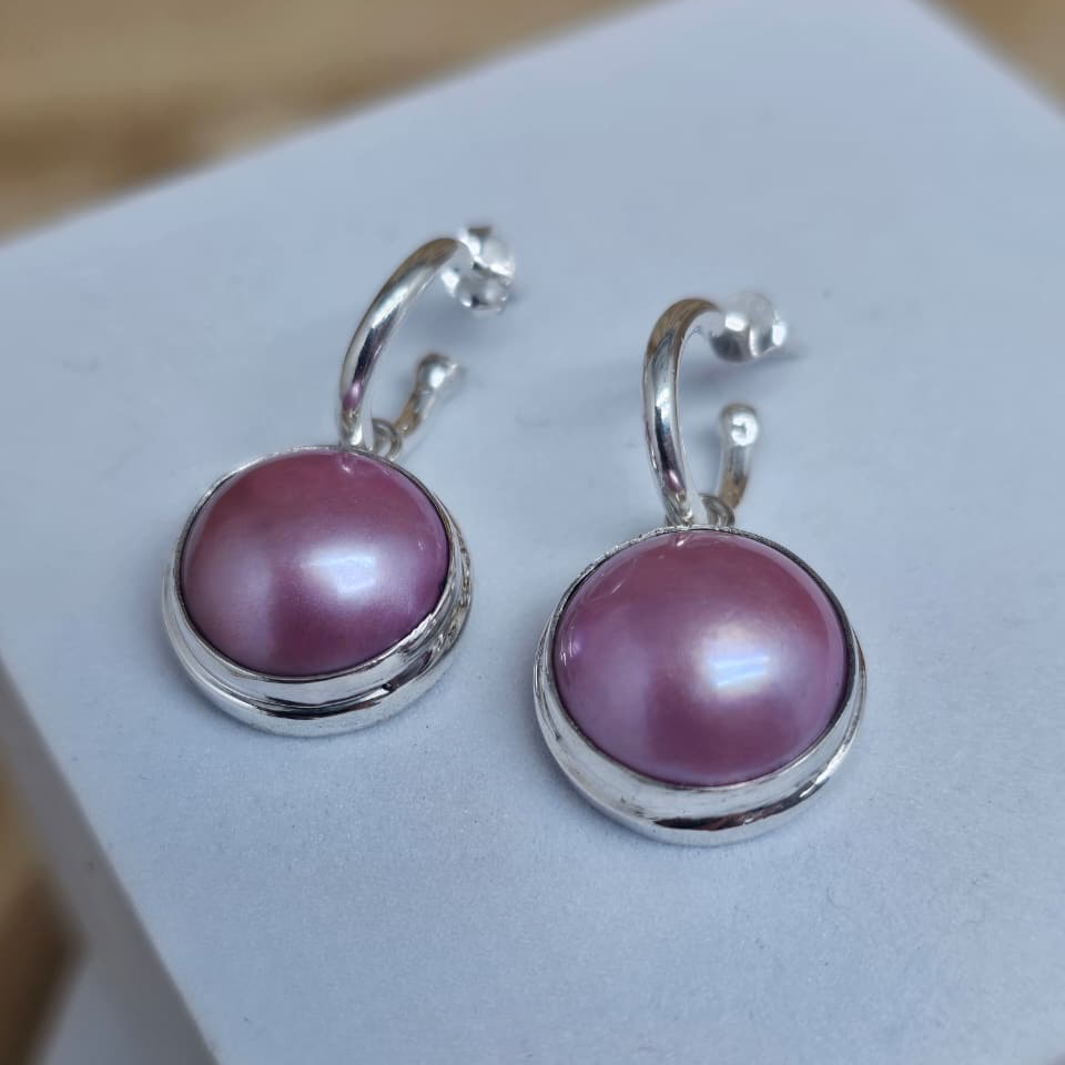 Pink Mabe Pearls on pretty woman earrings