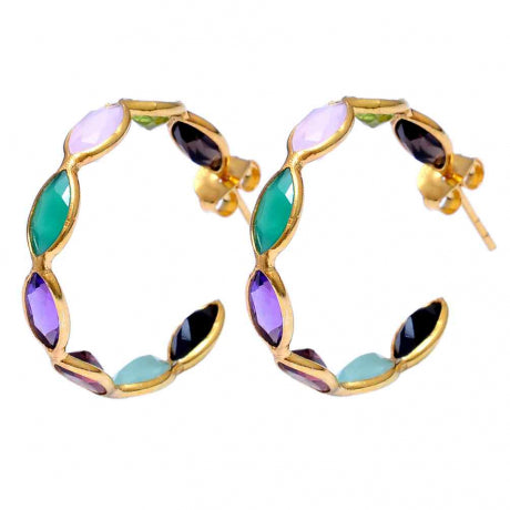 Gold hoop earrings with multicolored gemstones on a white background