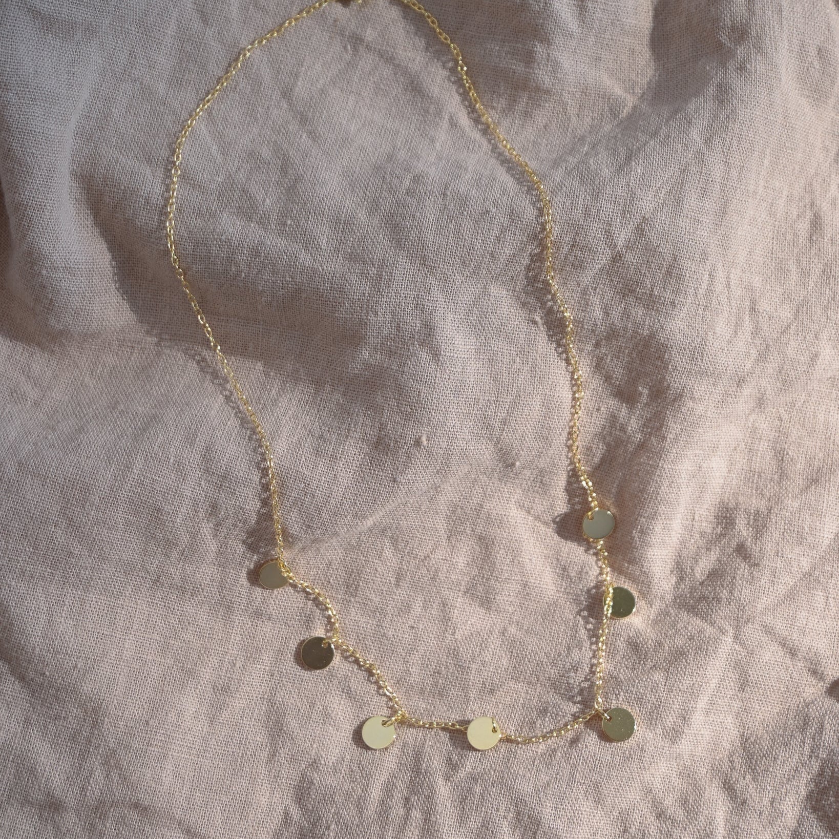 Gold seven disc necklace