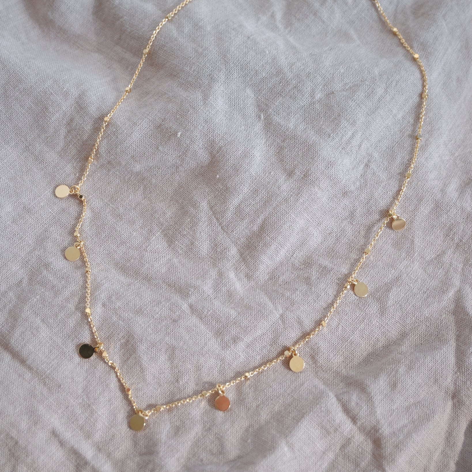 Gold disc ball necklace