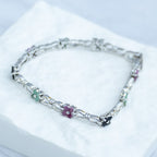 Sterling Silver Multi-Gemstone Flower Tennis Bracelet – Pink Ruby, Blue Sapphire & Light Emerald