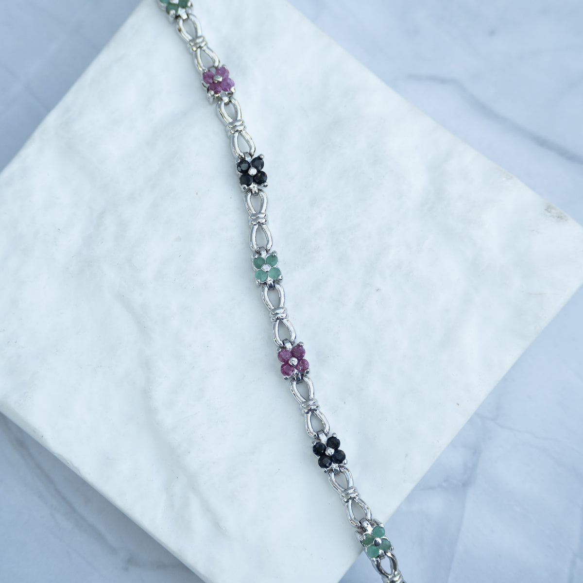 Sterling Silver Multi-Gemstone Flower Tennis Bracelet – Pink Ruby, Blue Sapphire & Light Emerald