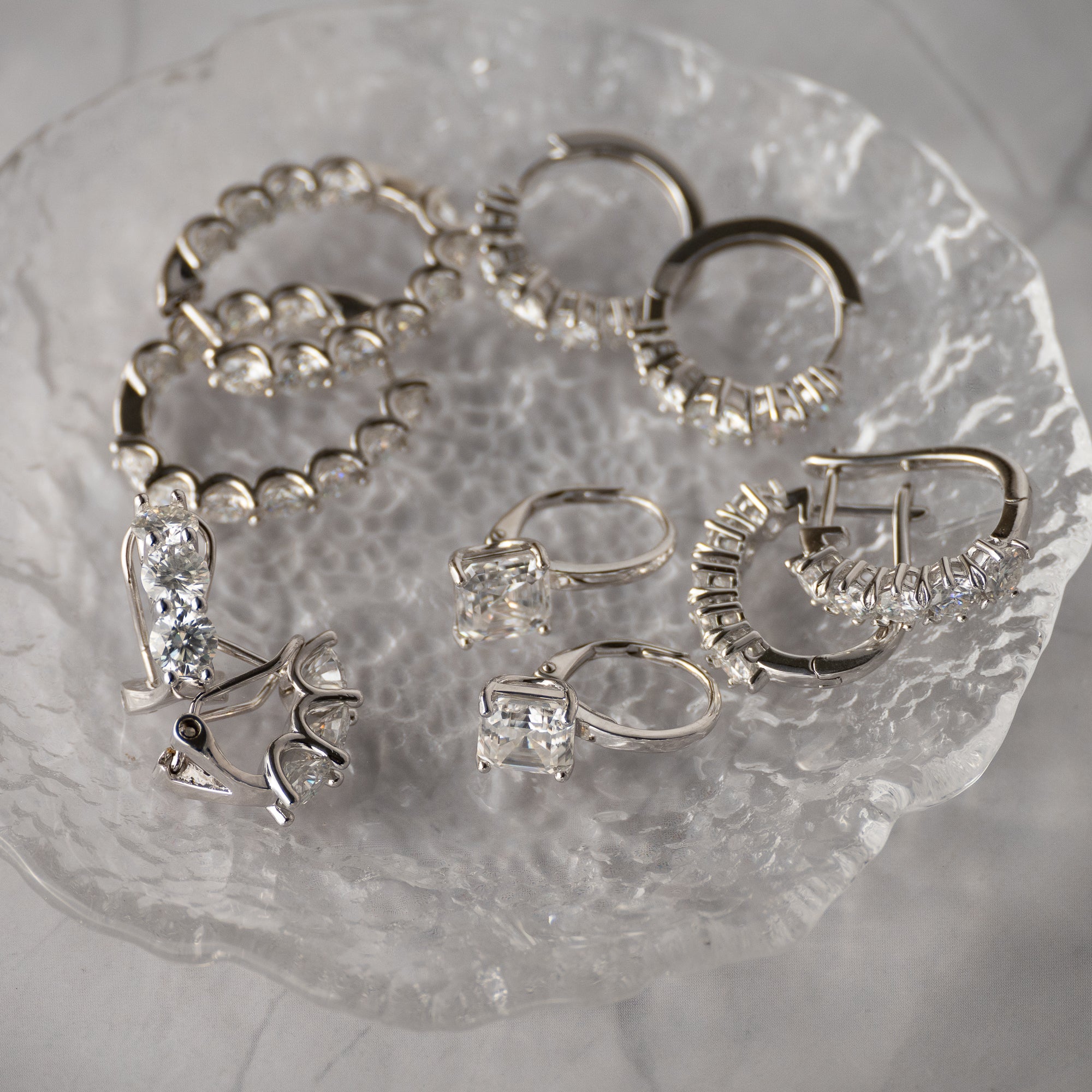 Five Moissanite huggy earrings
