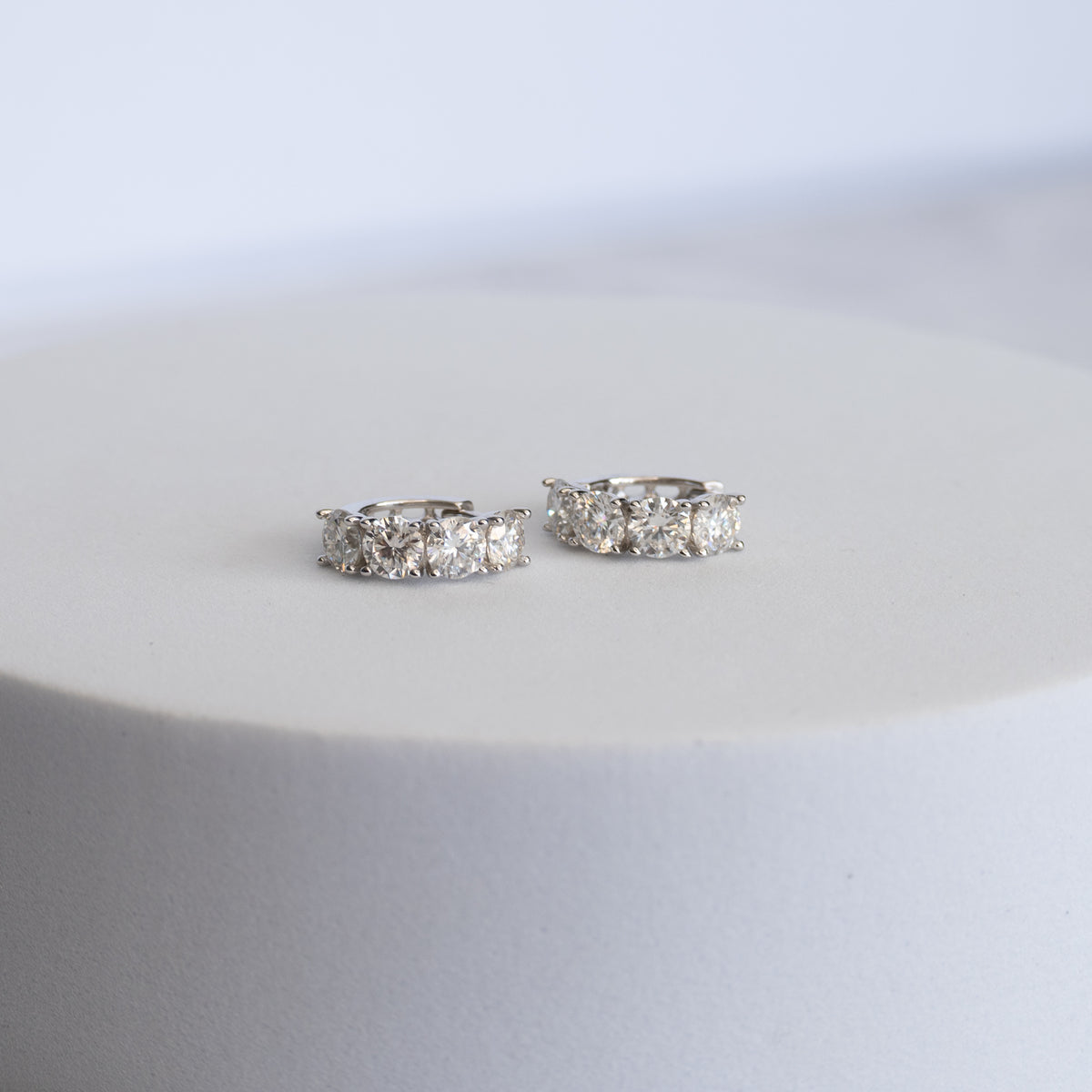 Sterling Silver Four-Stone Moissanite Huggie Earrings