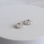 Sterling Silver Four-Stone Moissanite Huggie Earrings