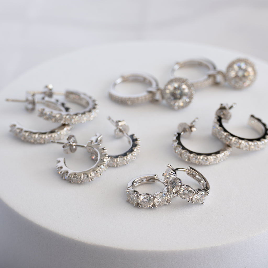 Sterling Silver Four-Stone Moissanite Huggie Earrings