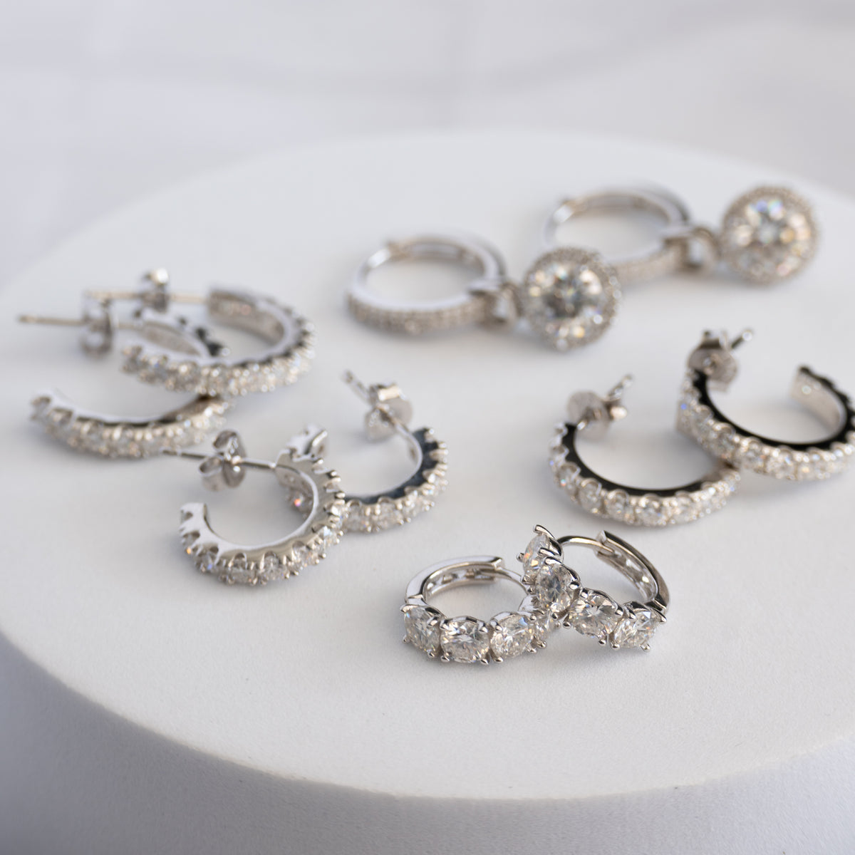 Sterling Silver Four-Stone Moissanite Huggie Earrings