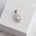 Sterling Silver Moissanite Sunburst Halo Pendant – 1ct Oval Centre Stone