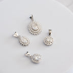Sterling Silver Teardrop Cluster Moissanite Pendant – 1ct Oval Centre Stone