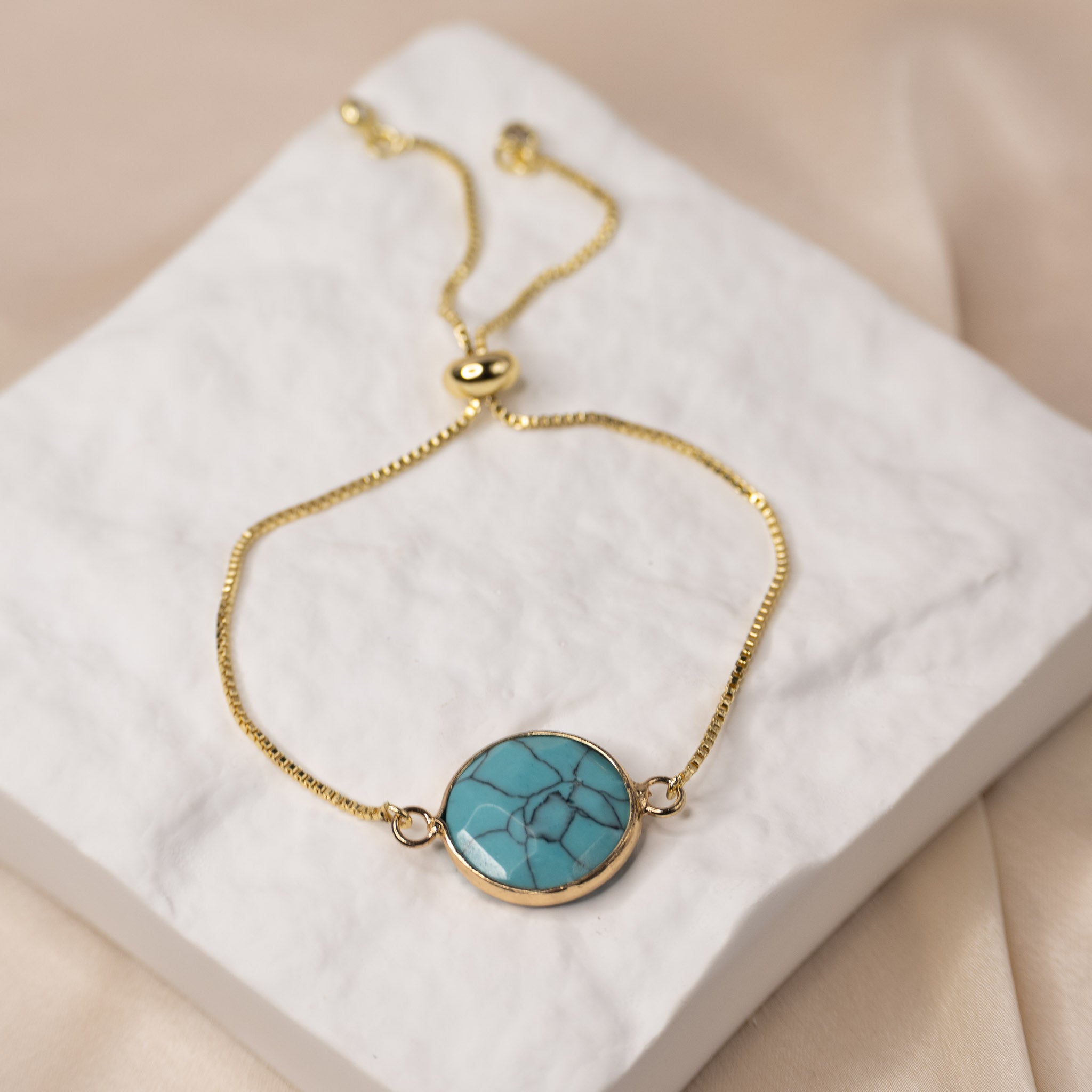 Adjustable Gold bracelet with a Howlite semi precious stone