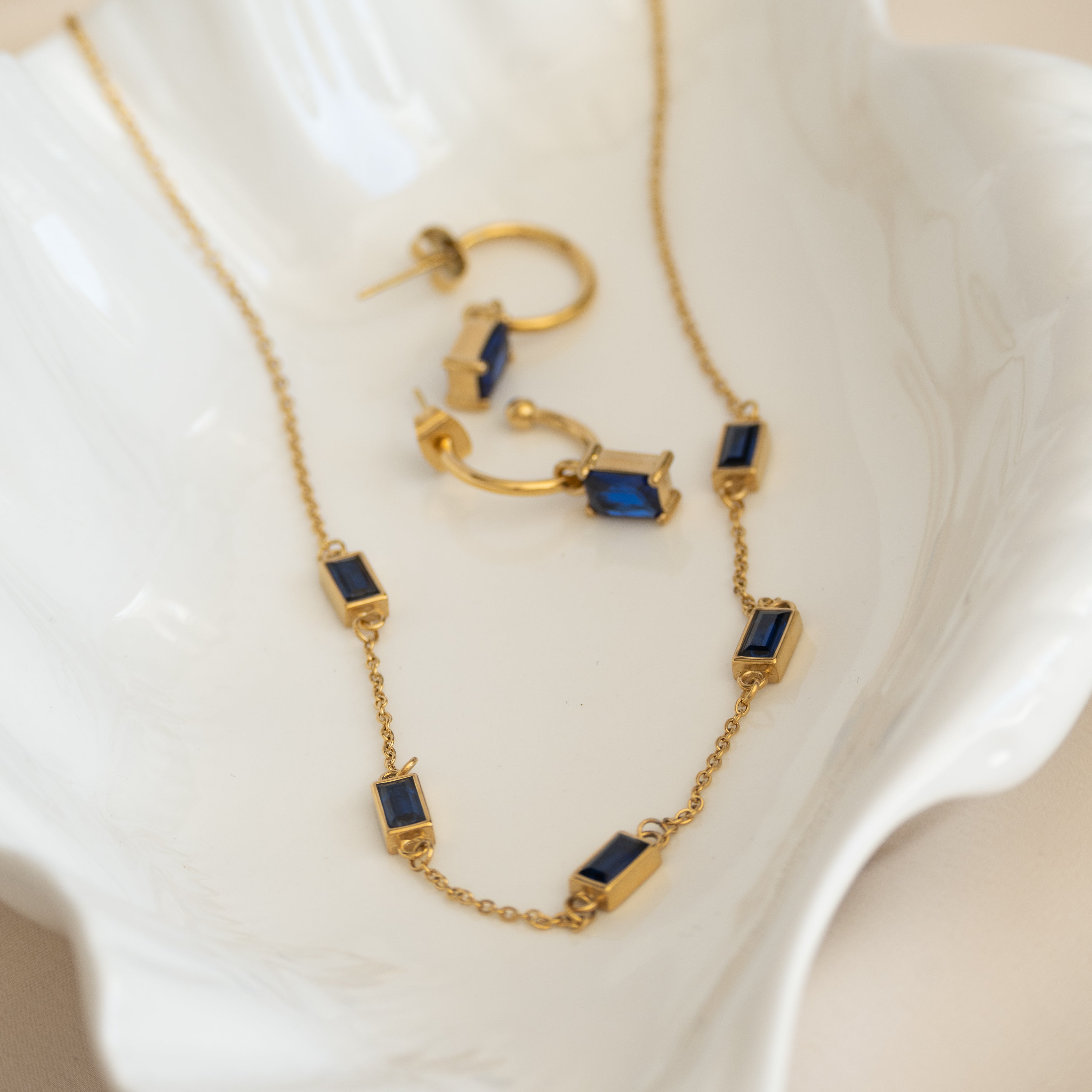 Gold pretty woman earrings with Blue Charms