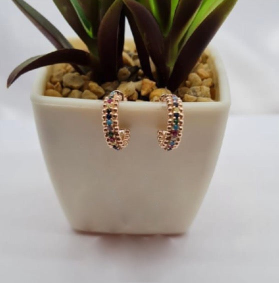 Rose gold hoops with rainbow coloured cubic zirconia