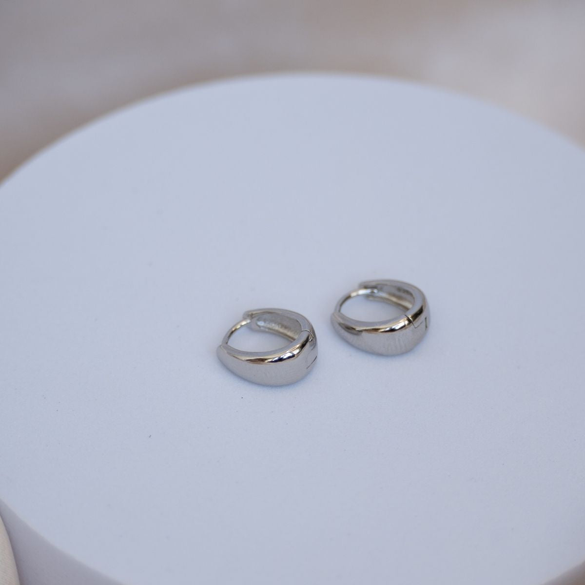 Teardrop shaped huggy earrings