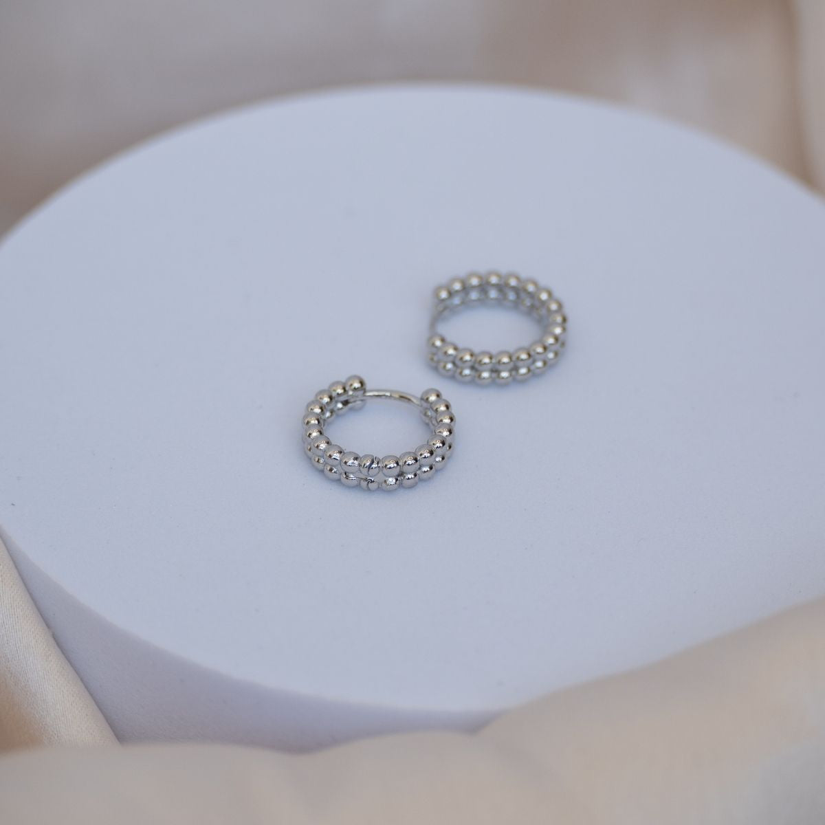 Double Bobble silver Huggy earrings