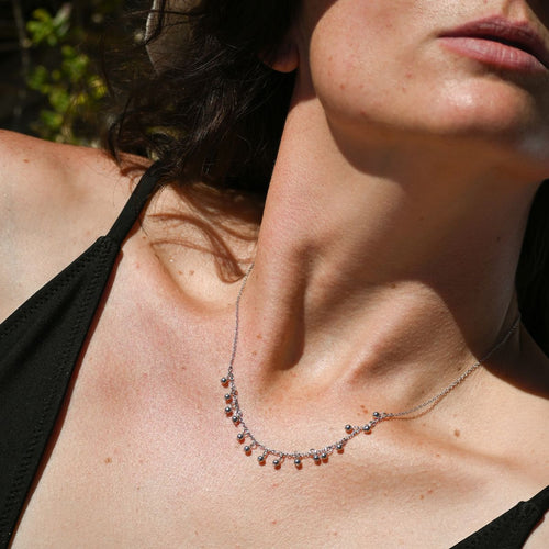 Necklace with lots of tiny silver drops