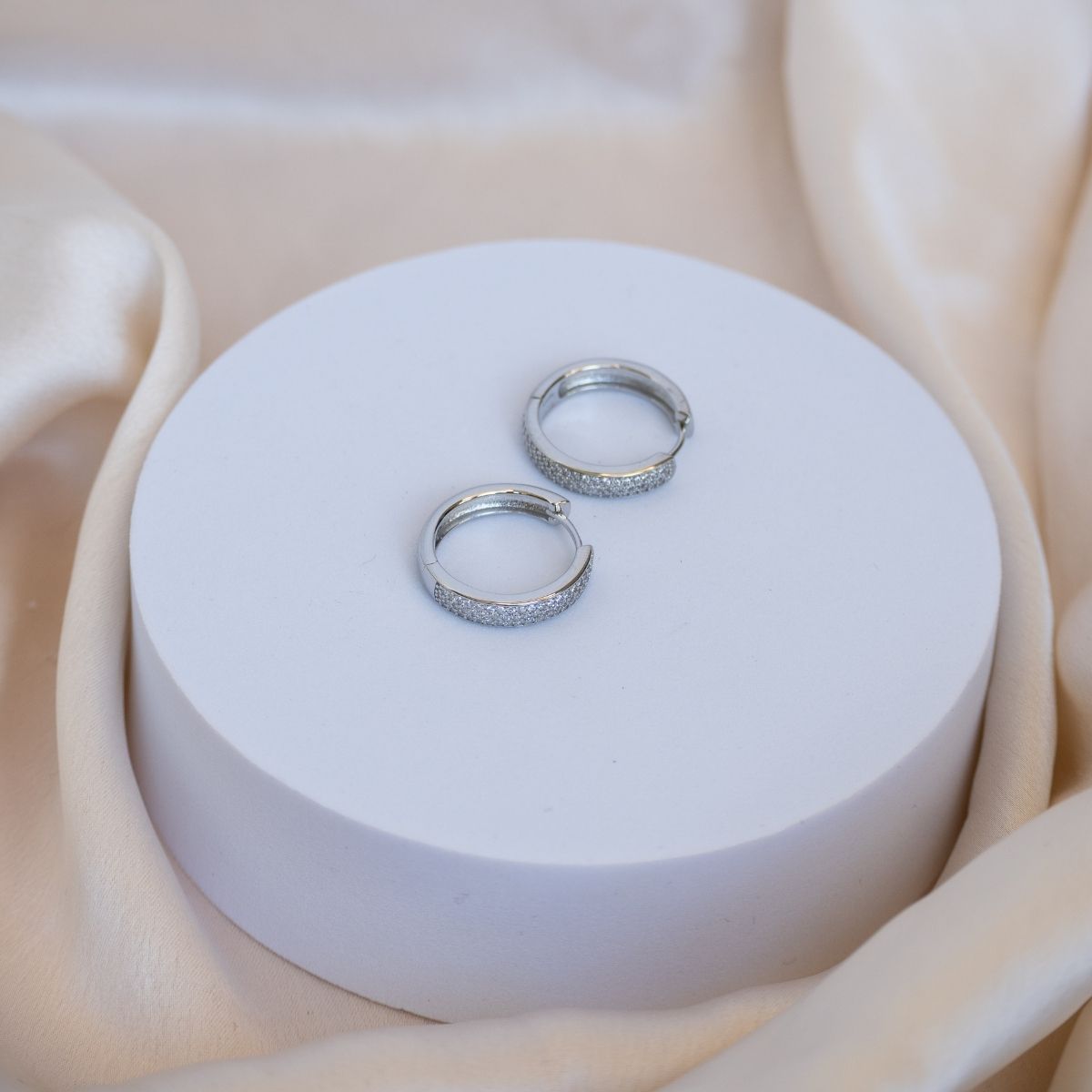 Silver showstopper huggy earrings with Cubic Pave