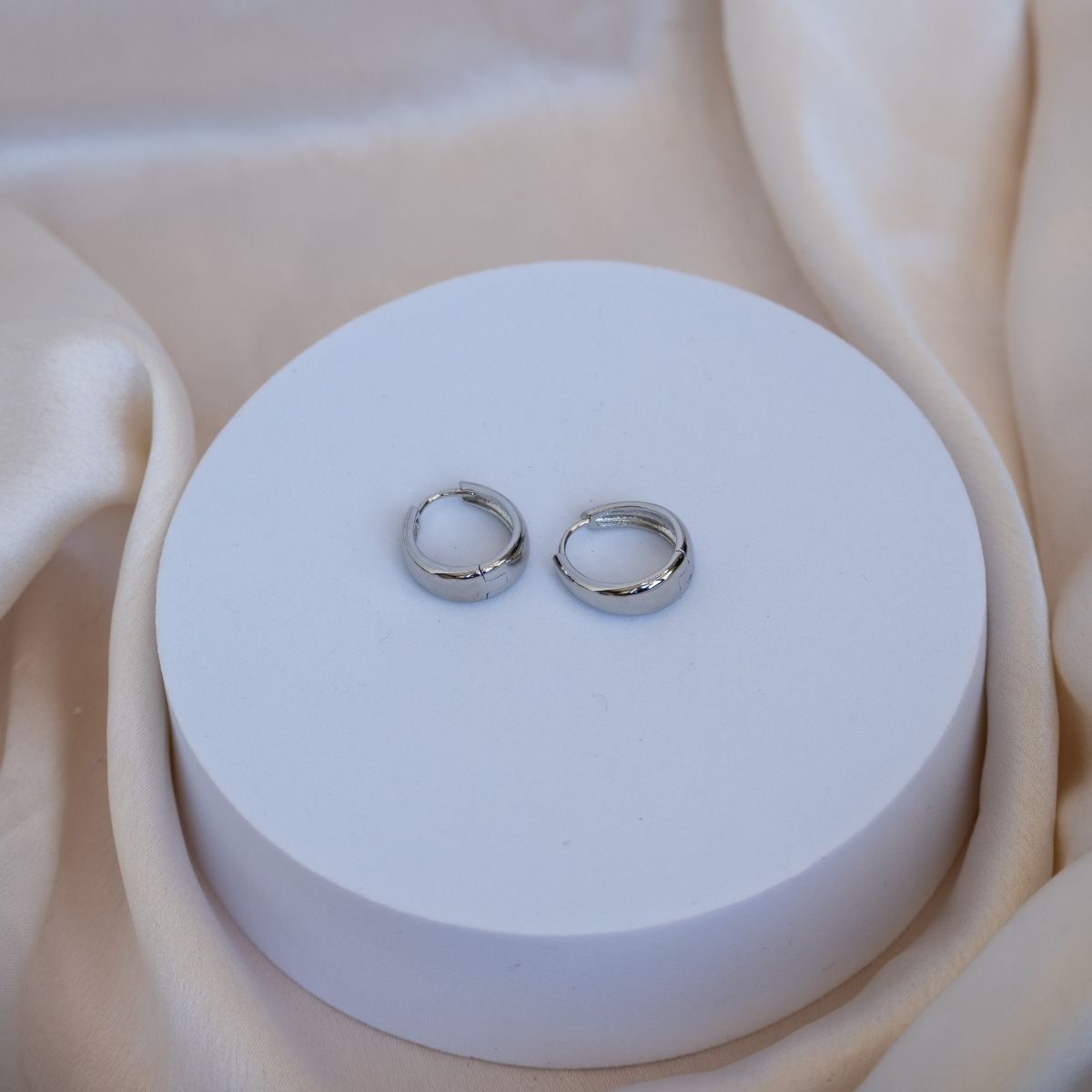 Teardrop shaped huggy earrings