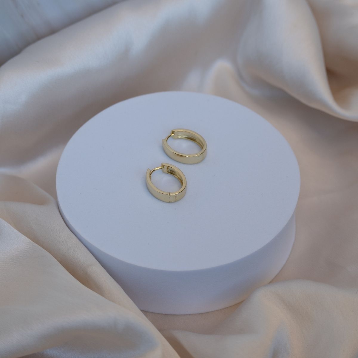 Gold Solid Oval huggy earrings