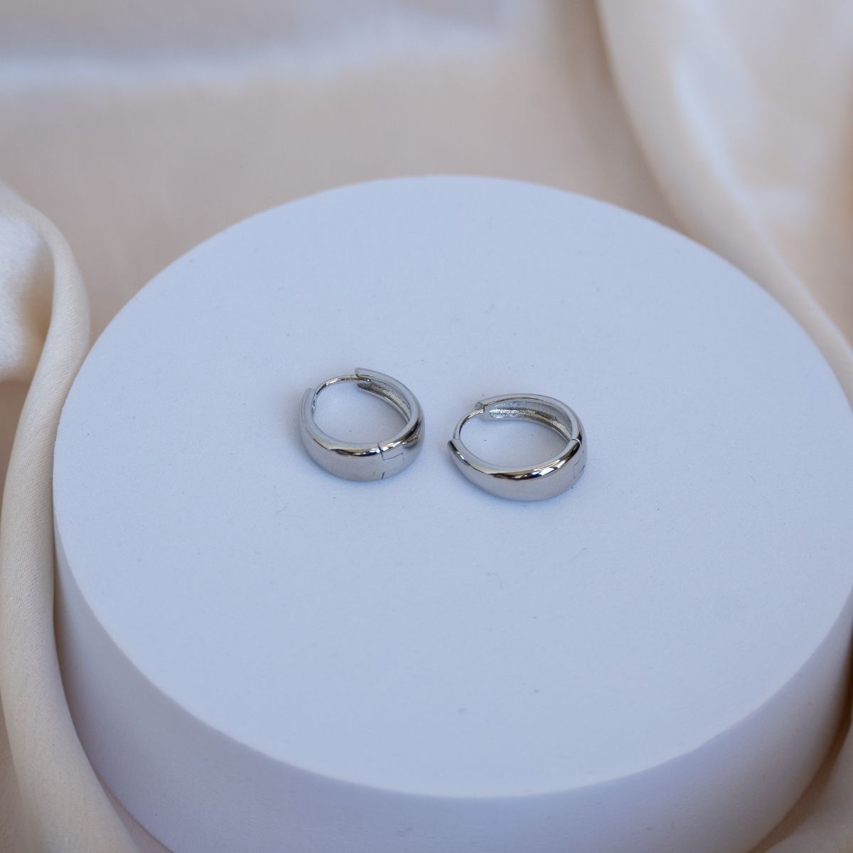 Teardrop shaped huggy earrings