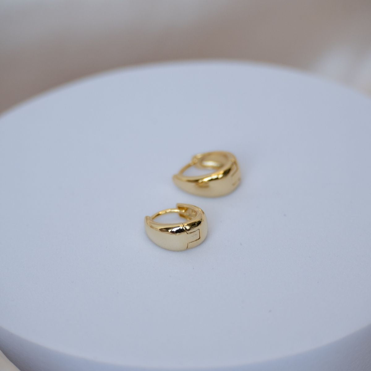 Gold teardrop Huggy earrings