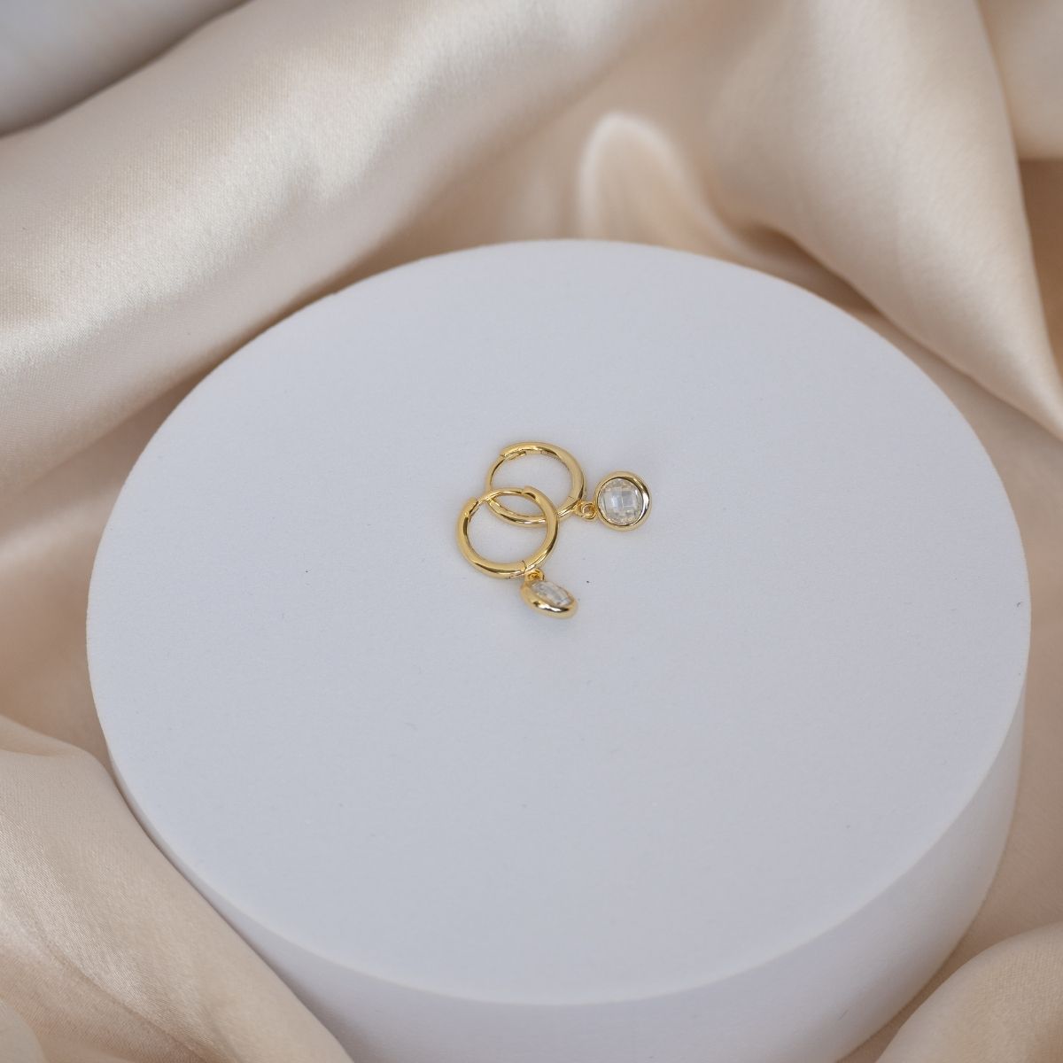 Gold Huggy earrings with dangly zirconia