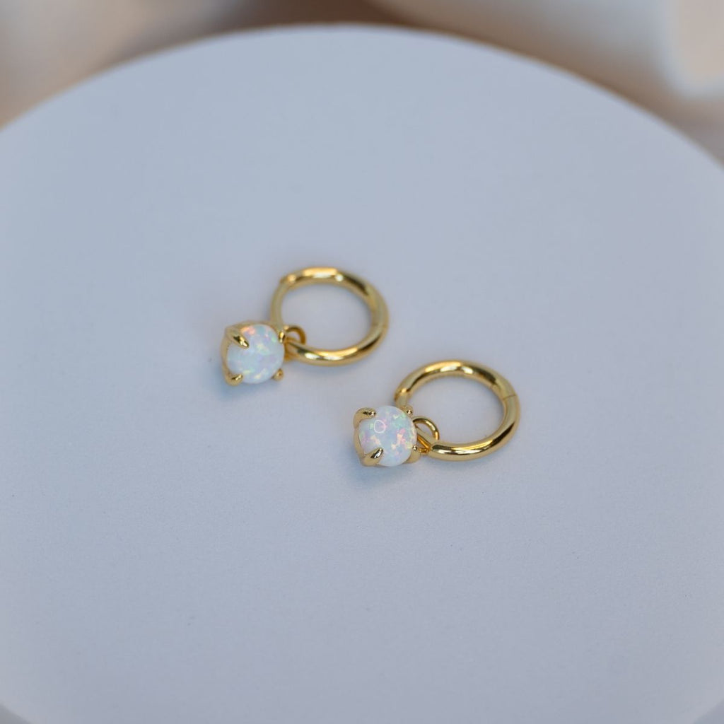 Gold huggy earring with Opal charm