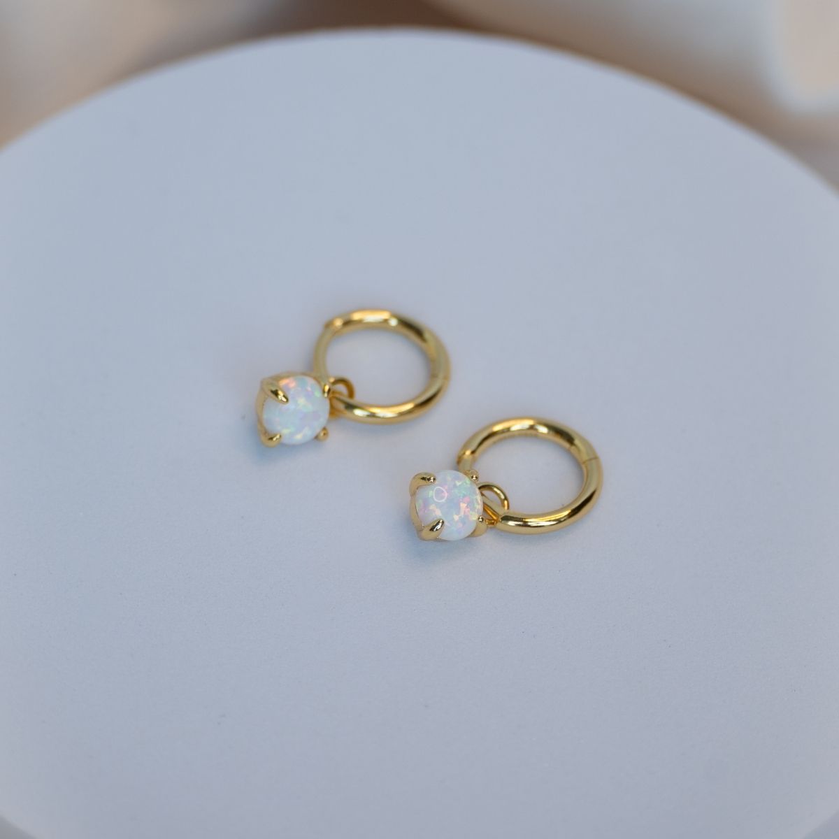 Gold huggy earring with Opal charm