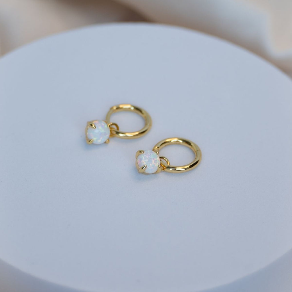 Gold huggy earring with Opal charm