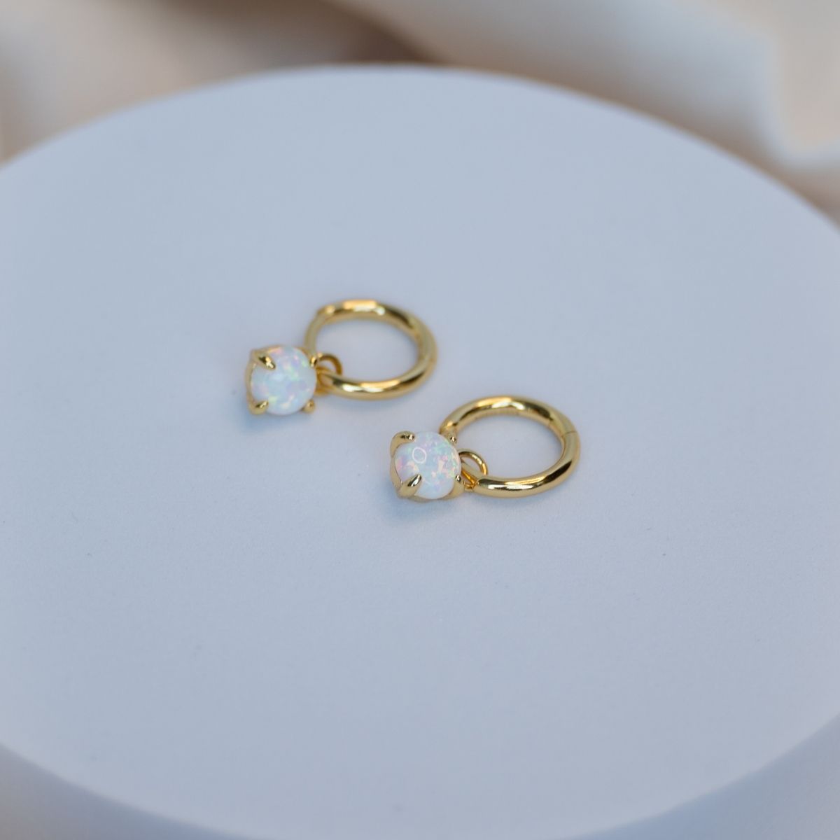 Gold huggy earring with Opal charm